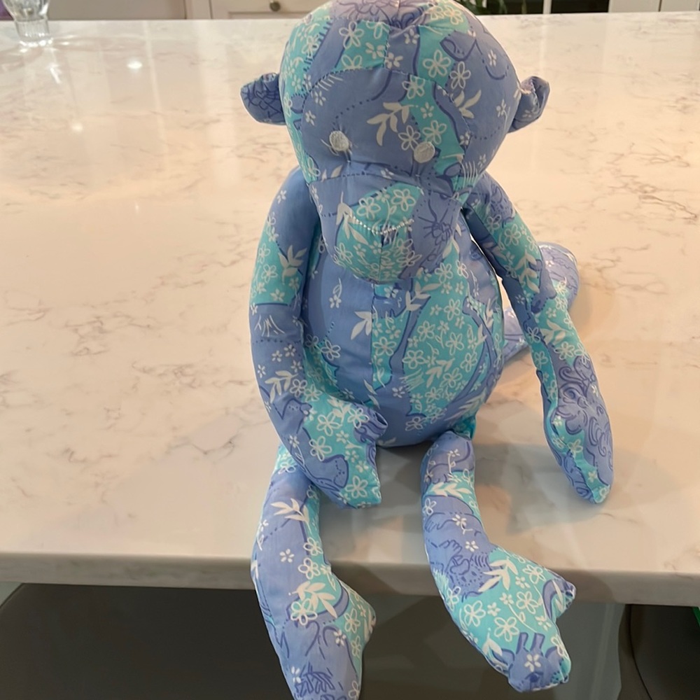 Lilly Pulitzer stuffed monkey. Blue Lilly print with jungle animals. New. No tag